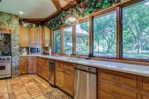 A row of windows in a kitchen letting in natural light.