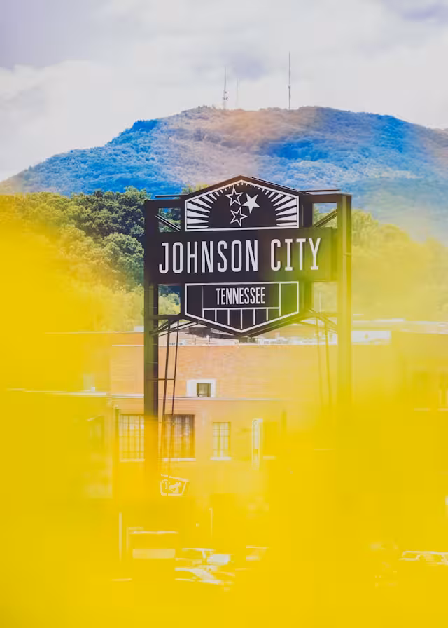 A brown sign with Johnson City, Tennessee to represent South Johnson City.