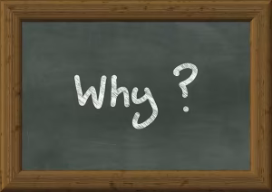 A chalkboard with the word "Why" on it.