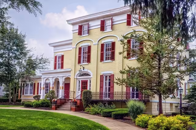 Yellow house with an entryway.