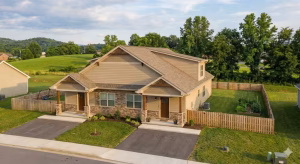 Side by side duplex in an open area.