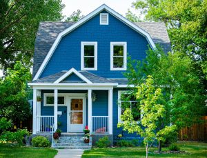 A blue Dutch colonial house in one of the good school districts and neighborhoods of the Tri-Cities.