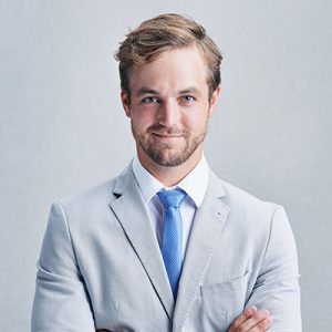 A man in a white suit.