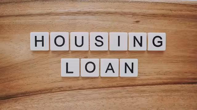 Housing loan spelled out in scrabble letters on a table.