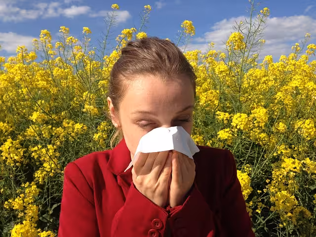 A woman with allergies in a field.
