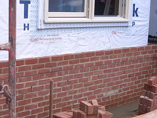 A house wrap with brick veneer.
