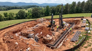 Workers laying a foundation on karst topography.